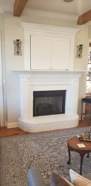 Brick fireplace and wood mantel, after Anthony's crew repainted it