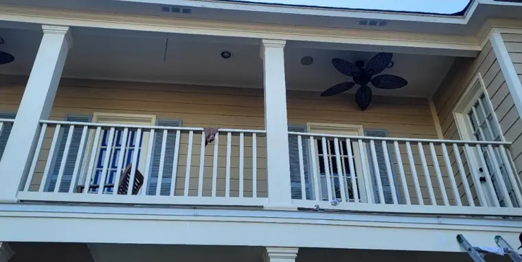 Balcony railing and porch ceiling, before painting