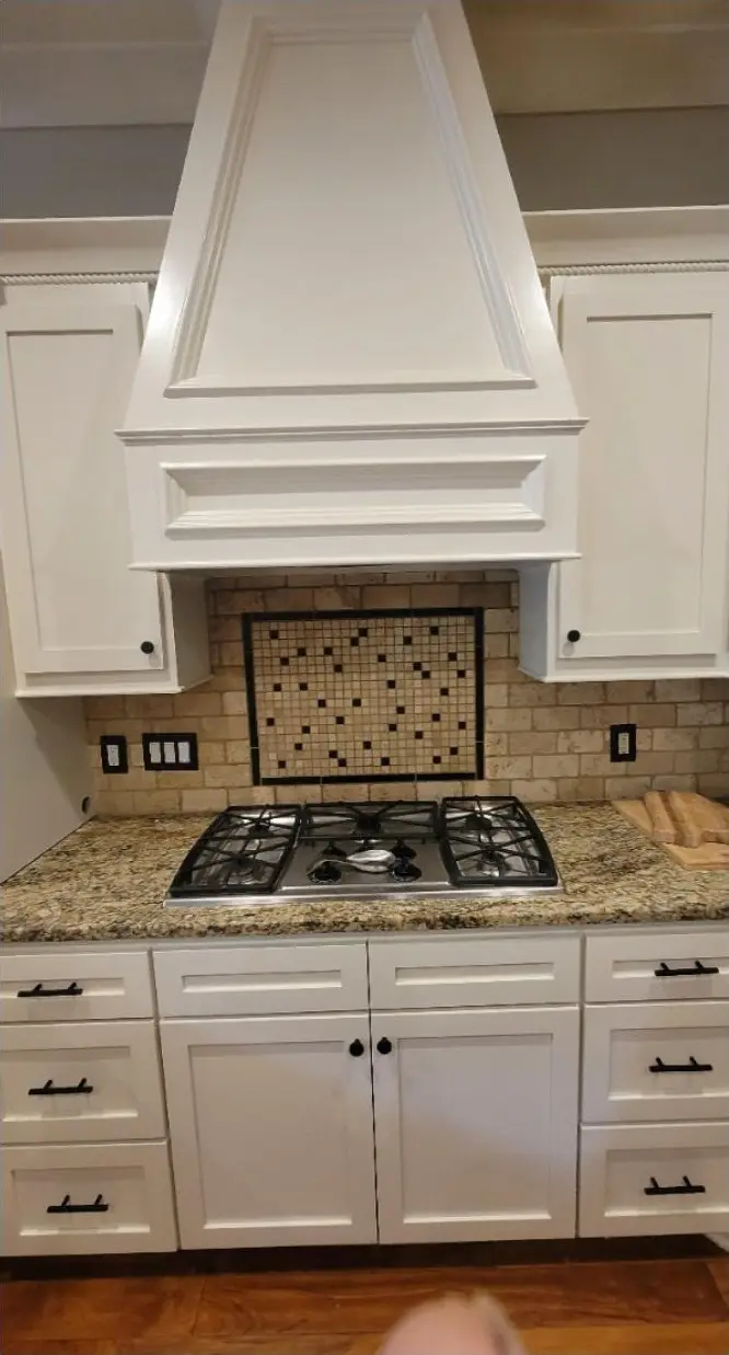Kitchen cabinets and range hood, after painting