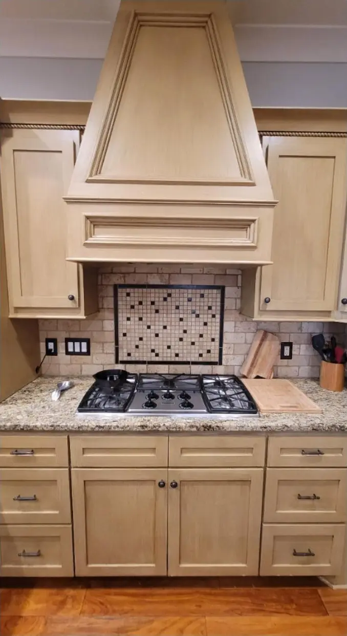 Kitchen cabinets and range hood, before painting