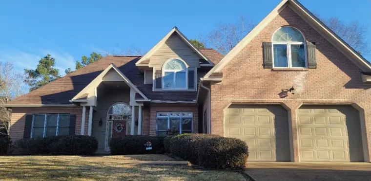 Home with a two-car garage, before painting